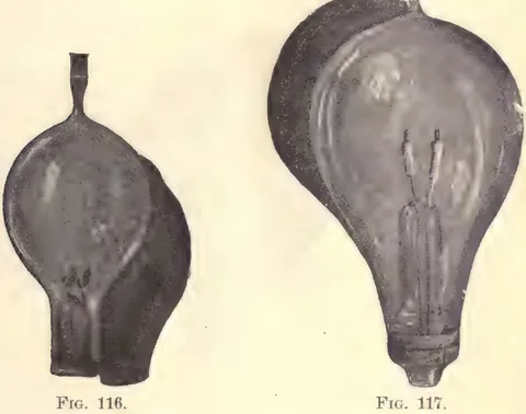 1894 photograph, figs. 116 and 117, printed p. 179: Two photographs of exhausted glass lamps with their printed captions FIG. 116. and FIG. 117.: left a globe with a refractory filament body, right a larger globe showing a refractory block clamped between two leads